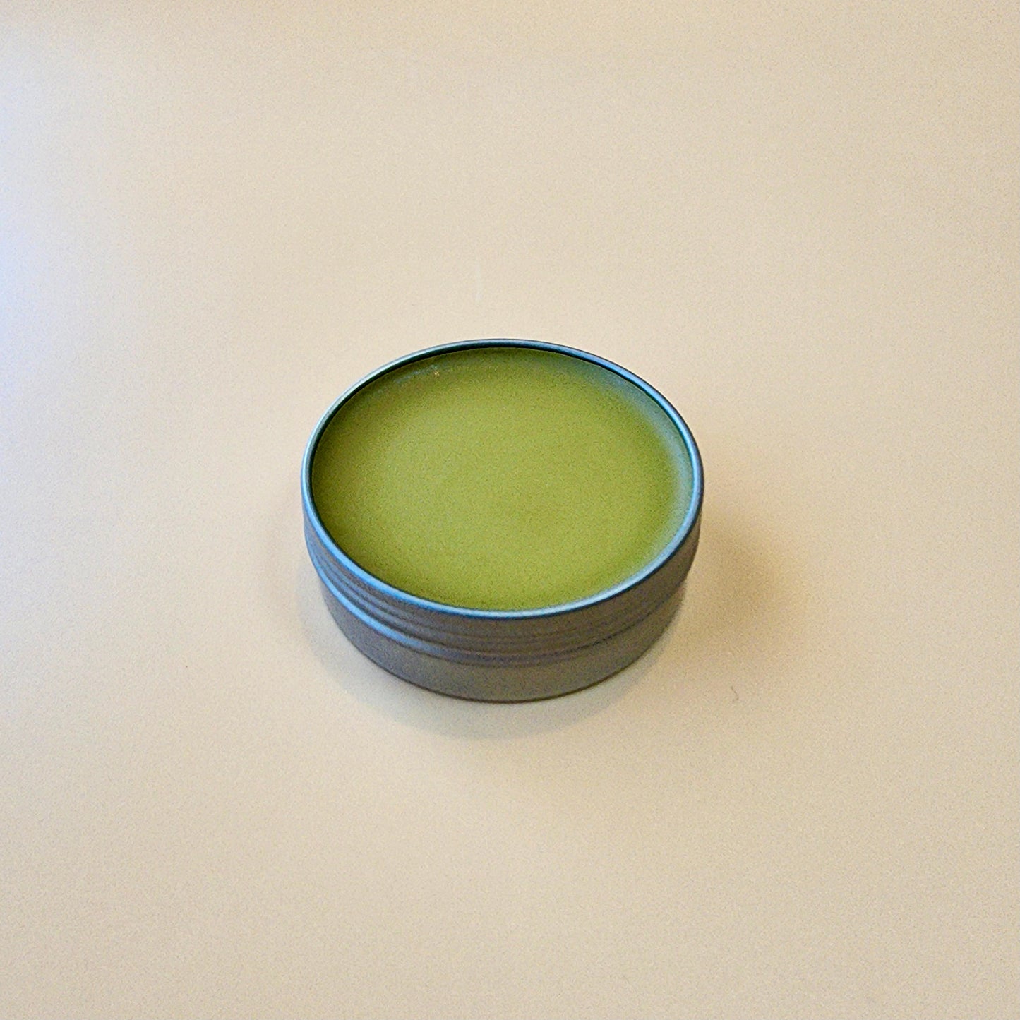 Open tin of MadeFromNature Mullein Salve — natural herbal botanical skin ointment handmade in Canada with health benefits for dry and sensitive skin