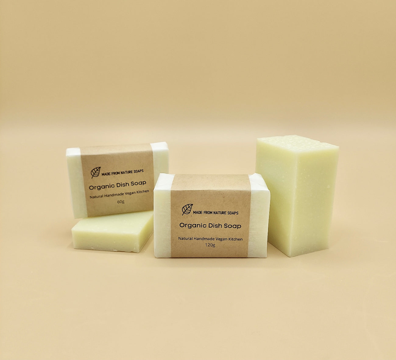 Bars of organic dish soap on a beige background Made with plant-based ingredients (such as coconut oil), they are free from harsh synthetic additives, parabens, and phosphates, making them gentle on hands and ideal for sensitive skin.